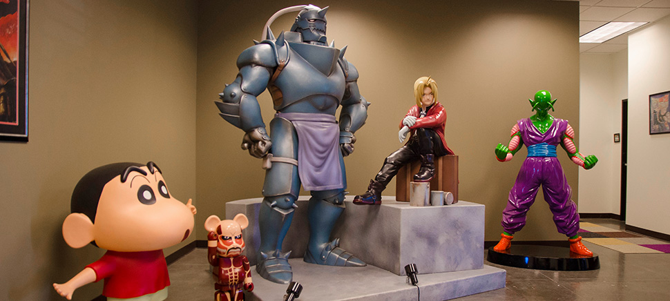 Large action figures great guests in the lobby of the Funimation office in Frisco. [Photo: Hannah Ridings]