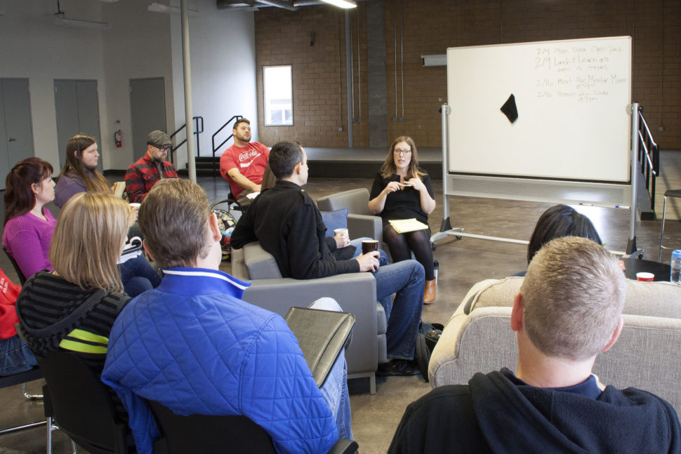 Heather Gregory leads a morning huddle with the coworkers and entrepreneurs that use the space in Stoke to run their business.