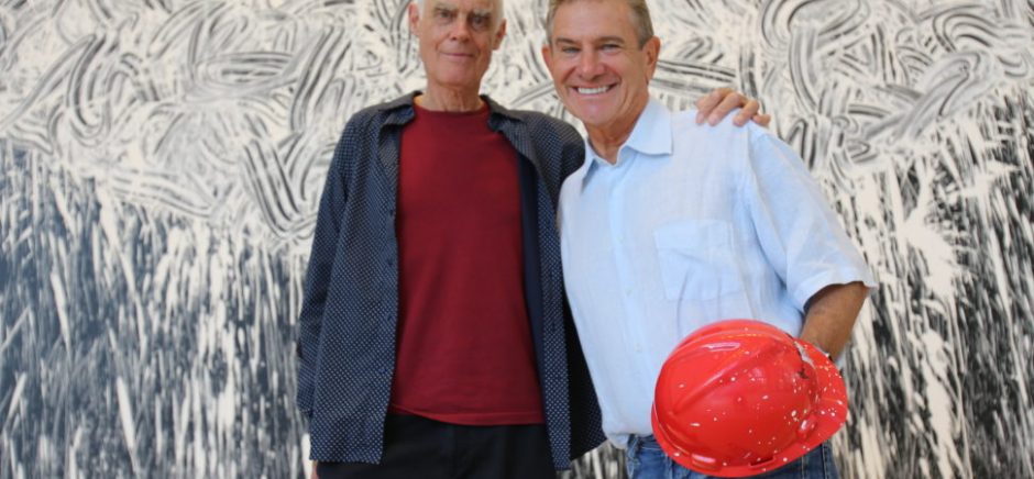 Craig Hall, right, and Richard Long in front of Dallas Rag in the KPMG Plaza lobby.