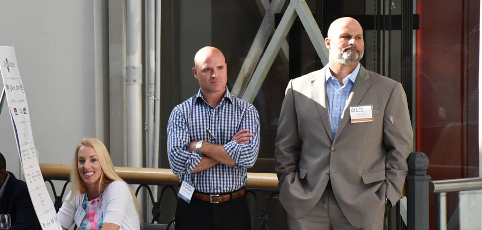 Shannon Helms, r2 Technologies Technical Recruiter at check in, along with Matt McGaughey, Spinakr Solutions Founder & CEO and A. Ravi Malick, Vistra Energy SVP Technology & CIO listen to the evening’s program