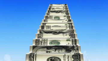 Money stairs with white 2016 arrow up shape clouds in blue sky.
