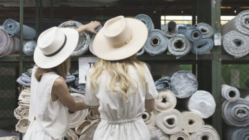 Founder Carly Burson and Katie Samson at a textile factory in Guatemala. [Photo courtesy of Tribe Alive]