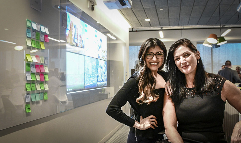 Women in AI: Tatianna Flores, head of the new Google Cloud AI Lab, and Windy Garrett, vice president of cloud partners and sales at Atos North America, in the new AI lab in Irving. [Photo: Maddie Preston]