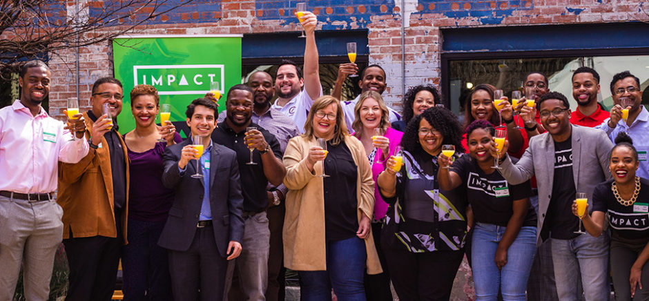 Entrepreneurs celebrate a 2019 Impact Ventures' cohort, photographed in the time before COVID. [Photo: Impact Ventures]