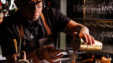 Shane Scully behind the bar. [Courtesy: Caché]