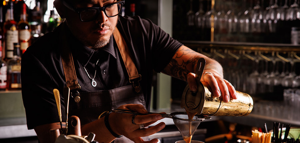 Shane Scully behind the bar. [Courtesy: Caché]