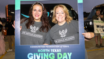 People holding sign for North Texas Giving Day.