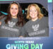 People holding sign for North Texas Giving Day.