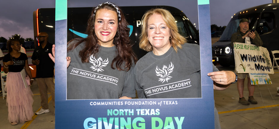 People holding sign for North Texas Giving Day.